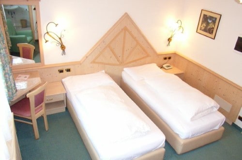 Twin room at Hotel Olympia in Arabba, Italy. Travel with World Lifetime Journeys