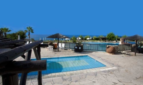 Pool view at Akteon Holiday Village in Paphos, Cyprus. Travel with World Lifetime Journeys