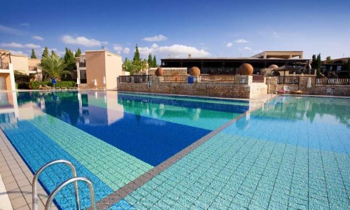 Pool side at Akteon Holiday Village in Paphos, Cyprus. Travel with World Lifetime Journeys