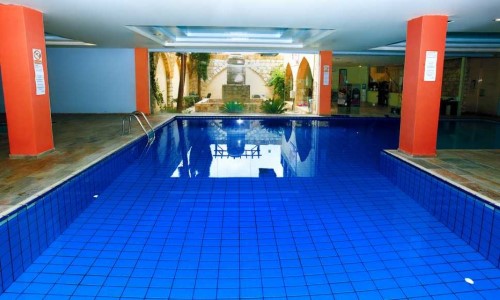 Indoor pool at Akteon Holiday Village in Paphos, Cyprus. Travel with World Lifetime Journeys