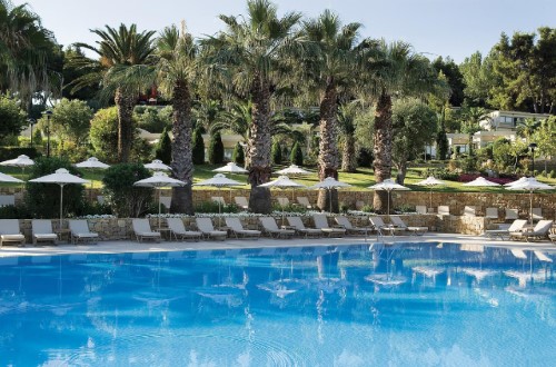 Beautiful garden and pool at Sani Club in Halkidiki, Greece. Travel with World Lifetime Journeys