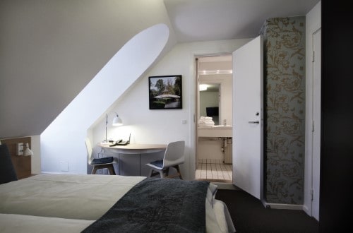 Deluxe room at Hotel Savoy in Copenhagen, Denmark. Travel with World Lifetime Journeys