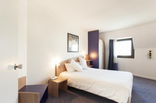 Double room at Canal Suites Hotel La Villette in Paris, France. Travel with World Lifetime Journeys