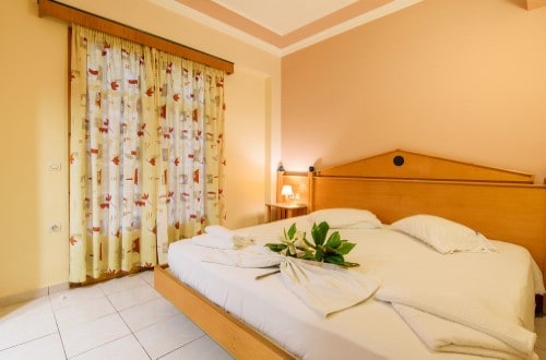 Double room at Plaza Pallas Hotel in Zakynthos, Greece. Travel with World Lifetime Journeys