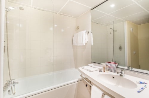 Ensuite bathroom at Canal Suites Hotel La Villette in Paris, France. Travel with World Lifetime Journeys