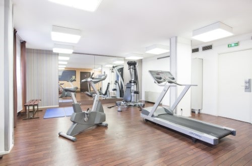 Fitness room at Canal Suites Hotel La Villette in Paris, France. Travel with World Lifetime Journeys