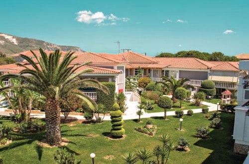 Garden view at Golden Sun Hotel in Zakynthos, Greece. Travel with World Lifetime Journeys