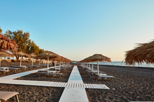 Lovely beach at Costa Grand Resort & Spa in Santorini, Greece. Travel with World Lifetime Journeys