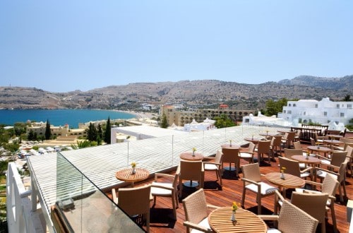 Outdoor restaurant at Lindos Village Resort in Rhodes, Greece. Travel with World Lifetime Journeys