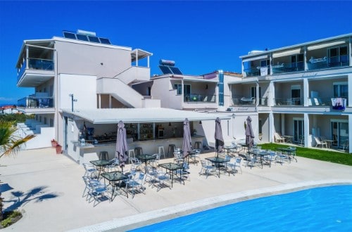 Outdoor terrace at Anna Hotel in Halkidiki, Greece. Travel with World Lifetime Journeys