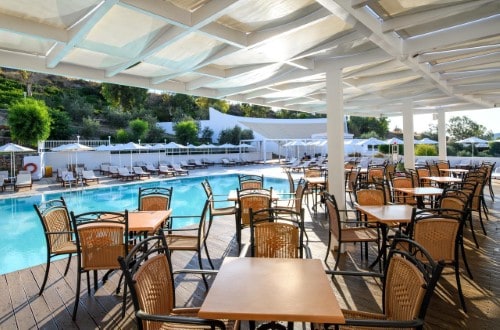 Outdoor terrace at Lindos Village Resort in Rhodes, Greece. Travel with World Lifetime Journeys