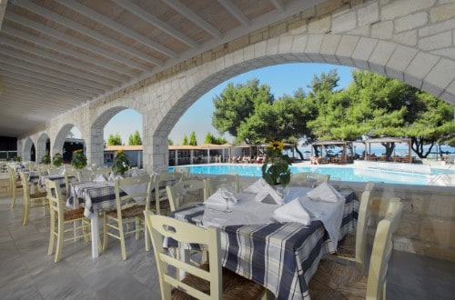 Outdoor terrace at Portes Beach Hotel in Halkidiki, Greece. Travel with World Lifetime Journeys