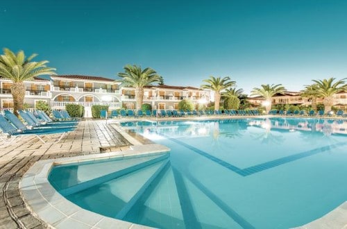 Pool side at Golden Sun Hotel in Zakynthos, Greece. Travel with World Lifetime Journeys