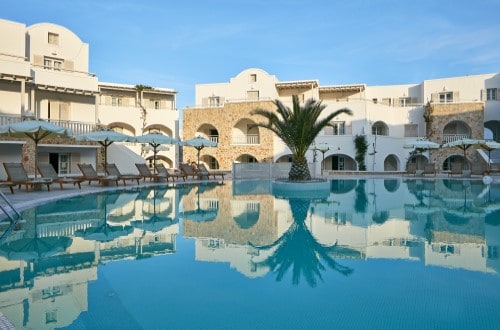 Pool side at Aegean Plaza Hotel in Santorini, Greece. Travel with World Lifetime Journeys