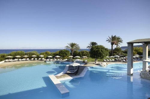 Pool side at Amathus Beach Hotel in Rhodes, Greece. Travel with World Lifetime Journeys