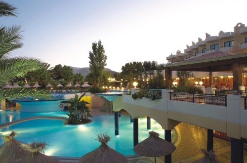 Pool side at Atrium Palace Thalasso Resort & Spa in Rhodes, Greece. Travel with World Lifetime Journeys