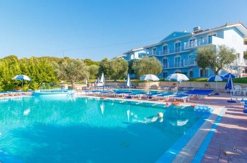 Pool side at Filoxenia Apartments in Rhodes, Greece. Travel with World Lifetime Journeys