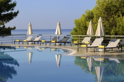 Pool side at White Rocks Hotel in Kefalonia, Greece. Travel with World Lifetime Journeys