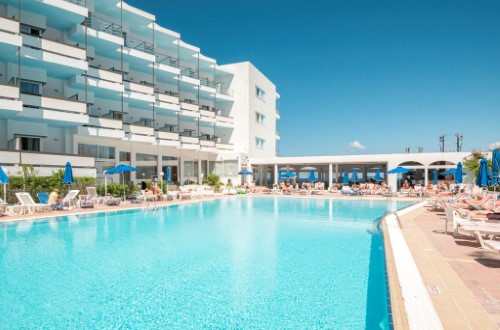 Pool side view at Belair Beach Hotel on Rhodes Island, Greece. Travel with World Lifetime Journeys