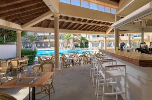 Pool terrace at Sun Beach Resort Complex Hotel in Rhodes, Greece. Travel with World Lifetime Journeys