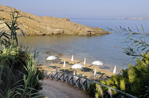 Private beach at White Rocks Hotel in Kefalonia, Greece. Travel with World Lifetime Journeys