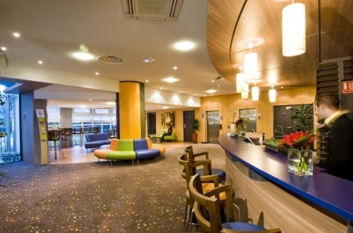 Reception area at Canal Suites Hotel La Villette in Paris, France. Travel with World Lifetime Journeys