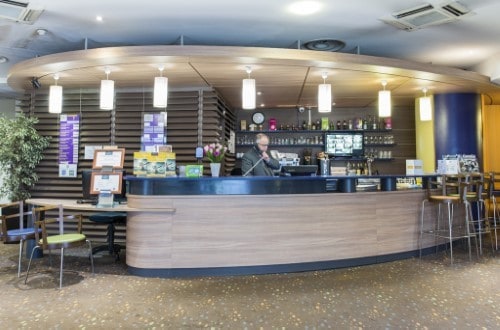 Reception area at Canal Suites Hotel La Villette in Paris, France. Travel with World Lifetime Journeys