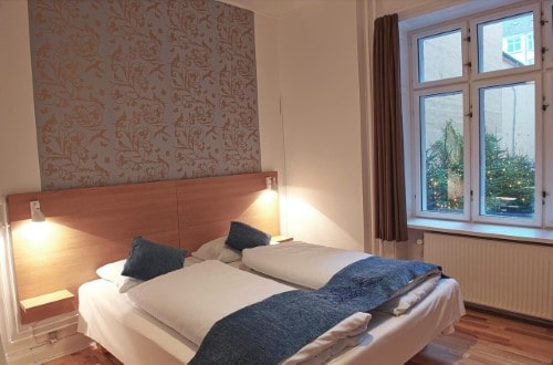 Small room at Hotel Savoy in Copenhagen, Denmark. Travel with World Lifetime Journeys