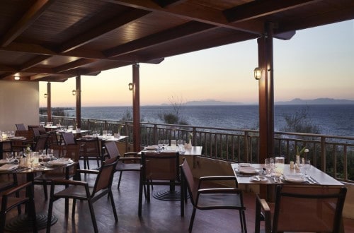 Terrace restaurant at Amathus Beach Hotel in Rhodes, Greece. Travel with World Lifetime Journeys