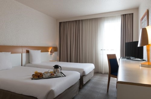 Twin room at Novotel Paris Est in Paris, France. Travel with World Lifetime Journeys