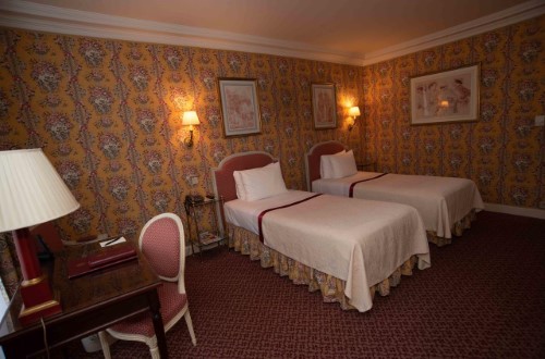 Twin room at Victoria Palace Hotel in Paris, France. Travel with World Lifetime Journeys