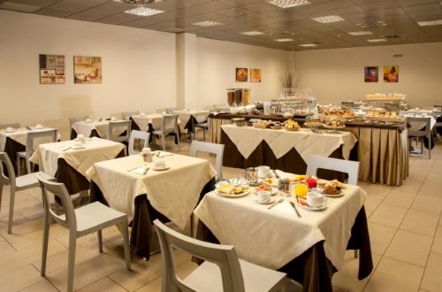 Breakfast room at Artis Hotel Rome in Rome, Italy. Travel with World Lifetime Journeys