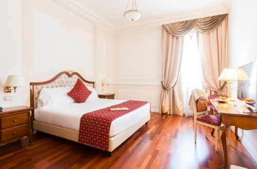 Double room at Grand Hotel Ritz in Rome, Italy. Travel with World Lifetime Journeys