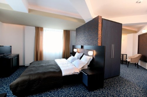 Double room at Hotel Ambiance in Bucharest, Romania. Travel with World Lifetime Journeys