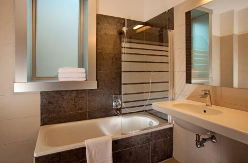 Ensuite bathroom at Artis Hotel Rome in Rome, Italy. Travel with World Lifetime Journeys