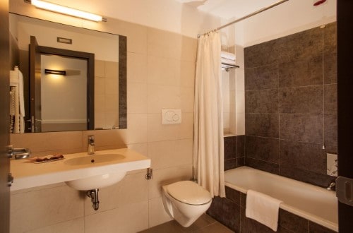 Ensuite bathroom at Artis Hotel Rome in Rome, Italy. Travel with World Lifetime Journeys