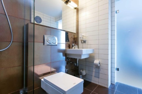 Ensuite bathroom at Comfort Hotel Xpress Youngstorget in Oslo, Norway. Travel with World Lifetime Journeys