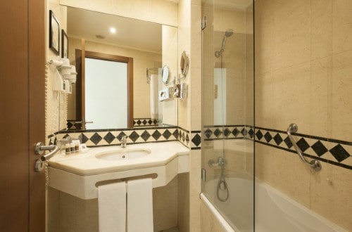 Ensuite bathroom at Hotel Turim Europa in Lisbon, Portugal. Travel with World Lifetime Journeys