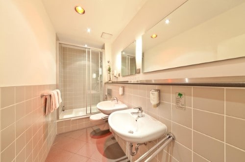 Ensuite bathroom at Novum Hotel Gates Berlin Charlottenburg in Berlin, Germany. Travel with World Lifetime Journeys