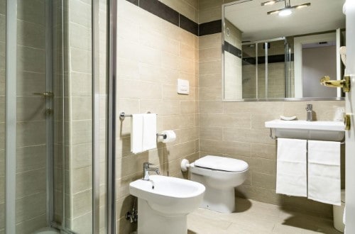 Ensuite bathroom at Pineta Palace Hotel in Rome, Italy. Travel with World Lifetime Journeys