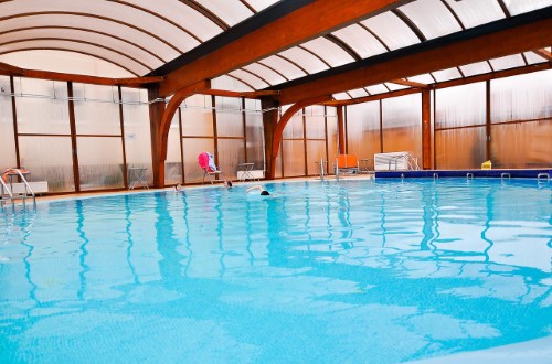 Indoor pool at Hotel Maxim in Oradea, Romania. Travel with World Lifetime Journeys