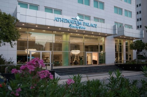 Main entrance at Athenaeum Palace Luxury Suites in Athens, Greece. Travel with World Lifetime Journeys