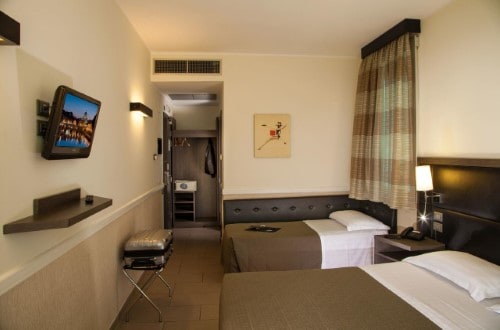 Twin room at Artis Hotel Rome in Rome, Italy. Travel with World Lifetime Journeys