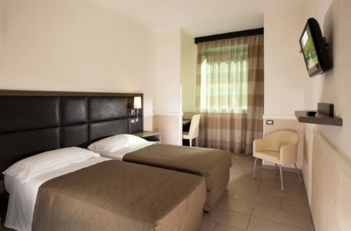 Twin room at Artis Hotel Rome in Rome, Italy. Travel with World Lifetime Journeys