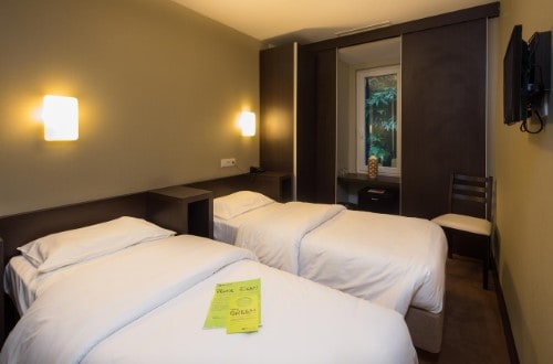 Twin room at Hotel Expo Astoria in Lisbon, Portugal. Travel with World Lifetime Journeys