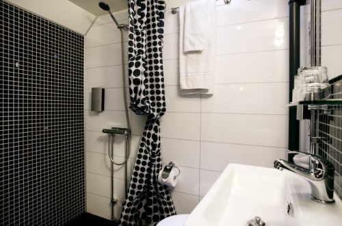 Ensuite bathroom at Malardrottningen Hotel in Stockholm, Sweden. Travel with World Lifetime Journeys