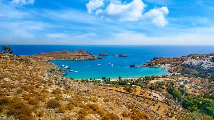 Beautiful Lindos beach on Rhodes island. Travel with World Lifetime Journeys