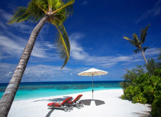 By the beach at OBLU Atmosphere Helengeli Maldives. Travel with World Lifetime Journeys